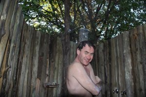 Aah, Rossy so loves being married to a photo-journalist ! Typical African outdoor shower.