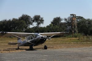James' Citabria waits patiently at Kariba for everyone else to fuel up. That is a spare control tower.